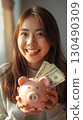 A woman enjoying saving money 130490309
