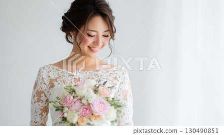 Beautiful bride and shining bouquet 130490851
