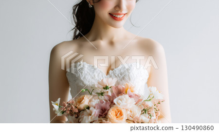 Beautiful bride and shining bouquet 130490860
