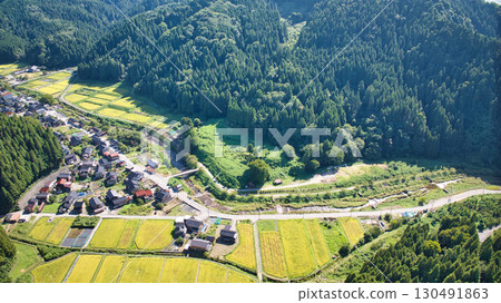 A view of the village and surrounding mountains in the Sasagawa district of Asahi Town in eastern Toyama Prefecture 130491863