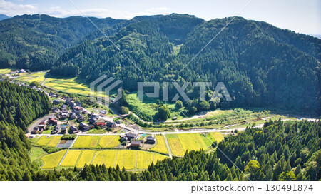 A view of the village and surrounding mountains in the Sasagawa district of Asahi Town in eastern Toyama Prefecture A view of the village and surrounding mountains in the Sasagawa district of Asahi Town in eastern Toyama Prefecture 130491874