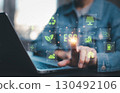 Man using computer and touching esg icon  for environmental,social and governance concept. 130492106
