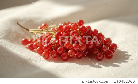 Red currants rest white linen soft morning light delicate fresh detail Red currants rest white linen soft morning light delicate fresh detail 130492369