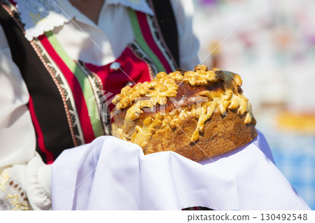 Welcome loaf in hand. Bread and salt as a Russian tradition. 130492548