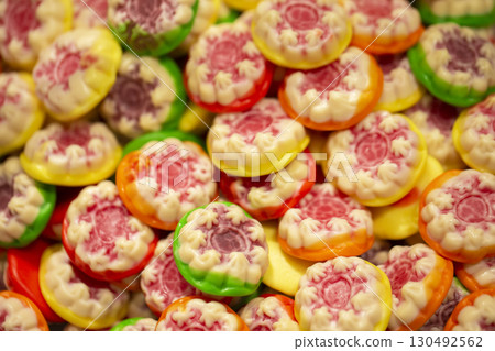 Sweets background. Bright gummy candies close-up. Close-up of colorful jujube background pattern Sweets background. Bright gummy candies close-up. Close-up of colorful jujube background pattern 130492562