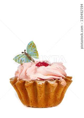 Cakes with protein cream decorated with a butterfly on a white plate. A beautiful sweet dessert. Cakes with protein cream decorated with a butterfly on a white plate. A beautiful sweet dessert. 130492594