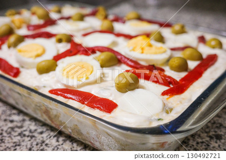 Traditional Spanish Ensaladilla Rusa with Boiled Eggs, Red Peppers and Olives Traditional Spanish Ensaladilla Rusa with Boiled Eggs, Red Peppers and Olives 130492721