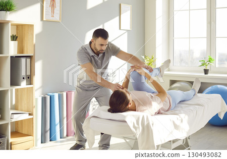 Woman Receiving Leg Massage During Physiotherapy And Rehabilitation Woman Receiving Leg Massage During Physiotherapy And Rehabilitation 130493082