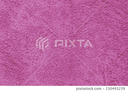 Close up, macro texture of pink suede, faux leather surface with natural pebble grain pattern Close up, macro texture of pink suede, faux leather surface with natural pebble grain pattern 130493239