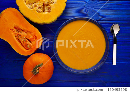 Pumpkin soup cream on wood Pumpkin soup cream on wood 130493398