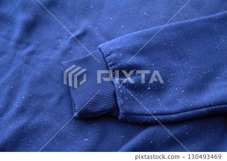 A used sweatshirt covered in pilling 130493469