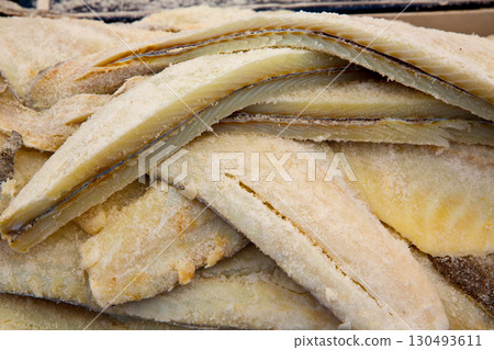 Cod fish salted codfish in a row stacked Cod fish salted codfish in a row stacked 130493611