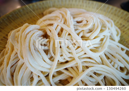 Freshly Made Kalguksu Noodles Close-Up. Flour-Dusted Handmade Pasta Freshly Made Kalguksu Noodles Close-Up. Flour-Dusted Handmade Pasta 130494260