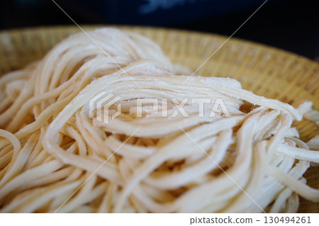 Freshly Made Kalguksu Noodles Close-Up.Flour-Dusted Handmade Pasta Freshly Made Kalguksu Noodles Close-Up.Flour-Dusted Handmade Pasta 130494261