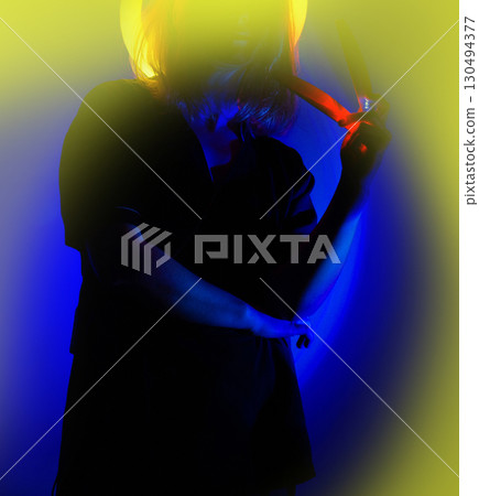 Happy stylish woman on bright neon background. Positive joyful young woman on bright neon background. 130494377