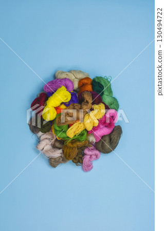 Mouline threads for embroidery displayed in a circle. Close up threads for sewing embroidery. Set of colored mouline. 130494722