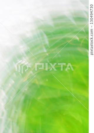 Green blurred bokeh background with motion effect. Green blurred bokeh background with motion effect. 130494730