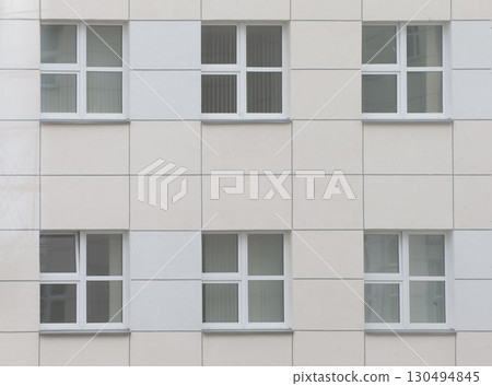Background windows in a modern building made of tiles. Background windows in a modern building made of tiles. 130494845