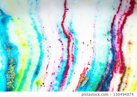 Multicolored colorful background of bright colors covered with gold sparkles. 130494874