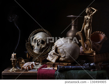 Dark still life with skull and mirror. 130494905