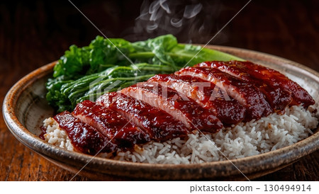 Glazed char siu pork served with rice and bok choy steaming warmly 130494914