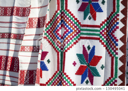 Slavic embroidered towels. National Ukrainian or Belarusian ethnic patterns on the fabric. 130495041