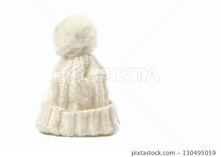 White knitted winter hat on a white background. White knitted winter hat on a white background. 130495059