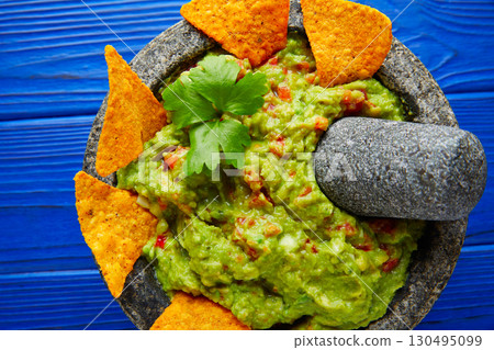 Guacamole with nachos in Mexican molcajete 130495099