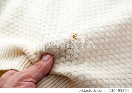 Frayed or moth-eaten sweaters Frayed or moth-eaten sweaters 130495204