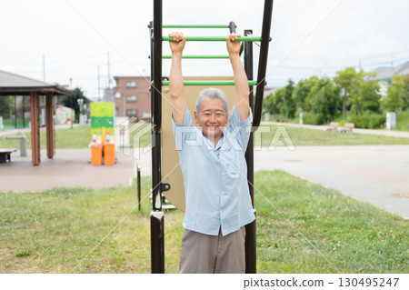 Senior men exercising in the park 130495247