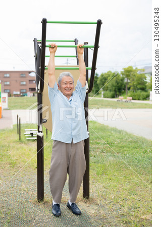 Senior men exercising in the park Senior men exercising in the park 130495248