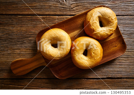 Bagels in a wooden board Bagels in a wooden board 130495353