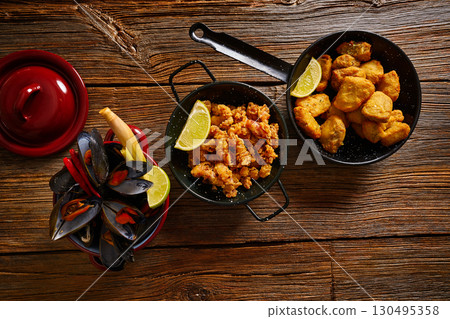 Fish seafood tapas adobo squid and mussels 130495358