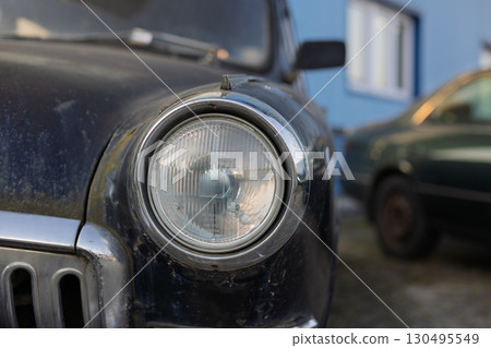 Close-up of vintage car headlight 130495549