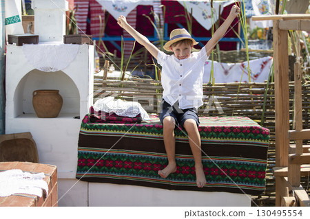 Belarusian or Ukrainian boy in an ethnic village. Belarusian or Ukrainian boy in an ethnic village. 130495554