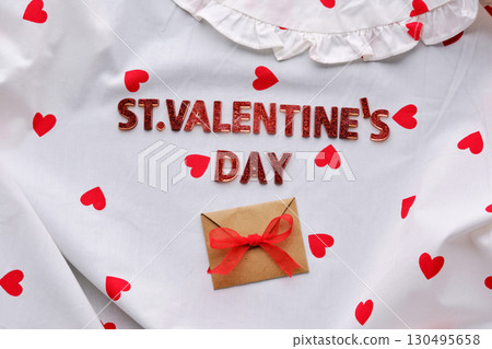 Festive St. Valentine's Day background of a white cotton blouse with hearts. 130495658