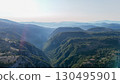 Majestic view of rolling hills and valleys at sunrise in a serene mountain landscape 130495901
