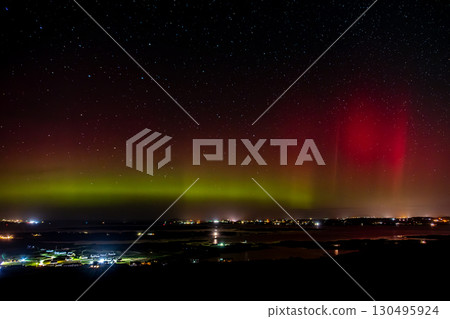 The Aurora Borealis, the northern lights, showing up above Maghery, Burtonport, Arranmore and Dungloe in County Donegal, Ireland. 130495924