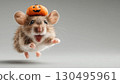 Joyful jumping mouse in tiny pumpkin hat, in air on light background with copy space, celebrating Halloween with adorable and festive expression. 130495961