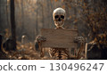 skeleton showing blank wooden sign in gloomy cemetery. Halloween party invitation mockup 130496247