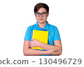 Caucasian male teen with glasses holding yellow notebook 130496729