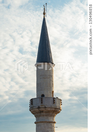 Istanbul, Turkey. Elegant minaret of an Ottoman-style mosque. Islamic architecture, cultural heritage, and the spiritual identity of Turkey. Istanbul, Turkey. Elegant minaret of an Ottoman-style mosque. Islamic architecture, cultural heritage, and the spiritual identity of Turkey. 130496858