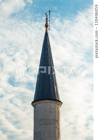 Istanbul, Turkey. Elegant minaret of an Ottoman-style mosque. Islamic architecture, cultural heritage, and the spiritual identity of Turkey. Istanbul, Turkey. Elegant minaret of an Ottoman-style mosque. Islamic architecture, cultural heritage, and the spiritual identity of Turkey. 130496859