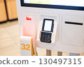 self-service ordering and credit card payment terminal menu in fast food restaurant 130497315