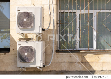 air conditioners are mounted on the wall. technologies for air cooling in hot weather. air conditioners are mounted on the wall. technologies for air cooling in hot weather. 130497428