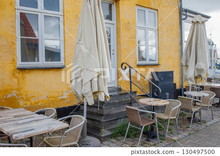 Tiny cozy cafe in Dragor town center near the sea in spring in the morning without people. 130497500