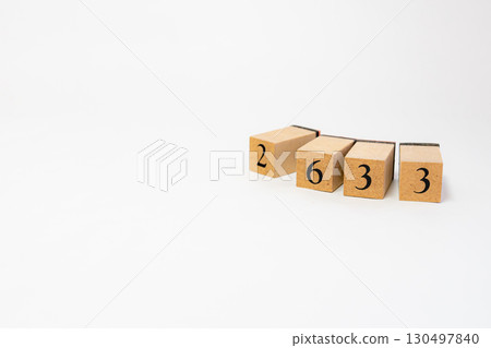 Product photography of numbers lined up on wooden blocks 2633 130497840
