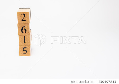 Product photography of numbers lined up on wooden blocks 2615 130497843