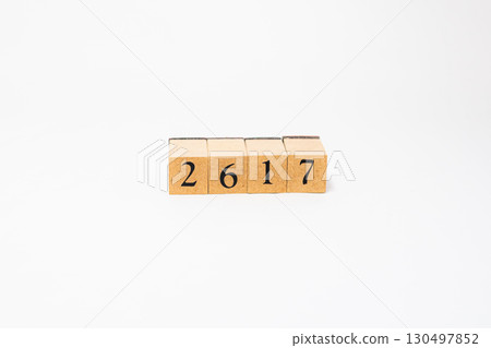Product photography of numbers lined up on wooden blocks 2617 130497852