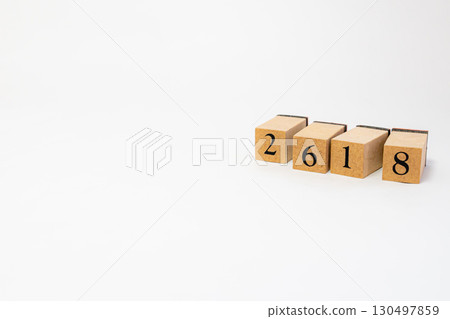 Product photography of numbers lined up on wooden blocks 2618 130497859